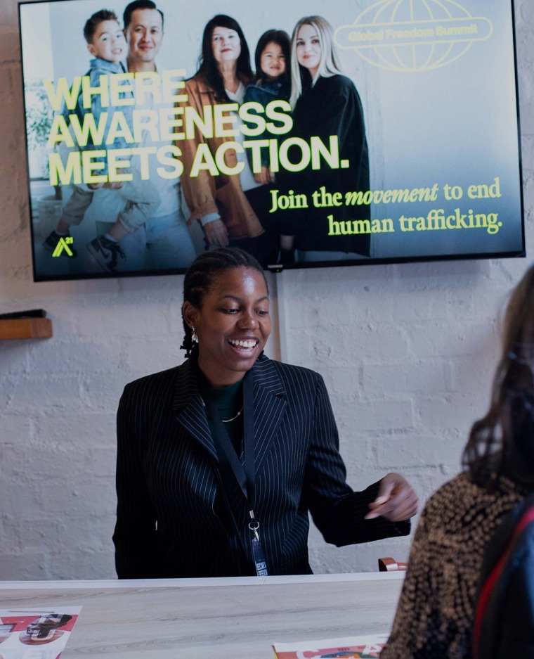 Global Freedom Summit 2026. Girl at desk