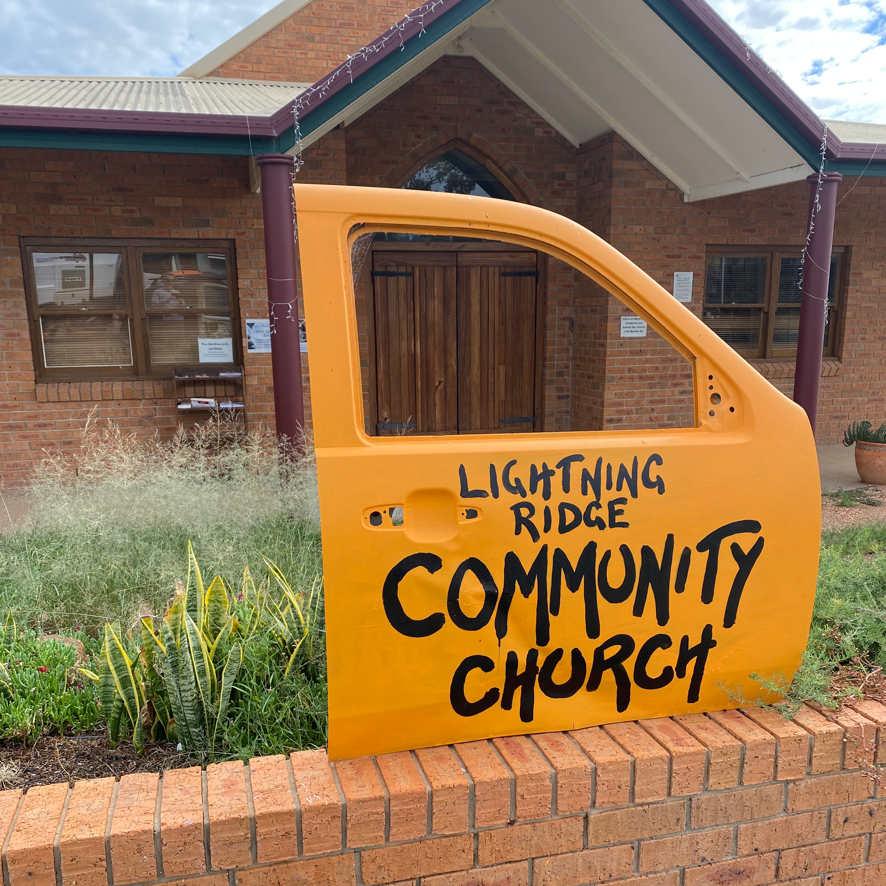 Lightning Ridge Community Church with the ubiquitous car door address identification